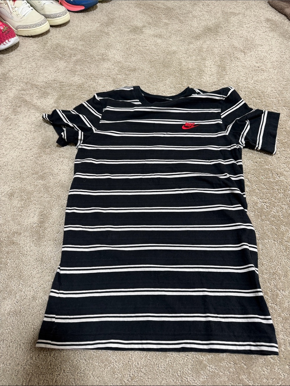 Nike Black and White Striped Kids Tee with Red Nike Swoosh